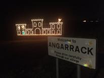 Eleven Pipers Piping and village sign...